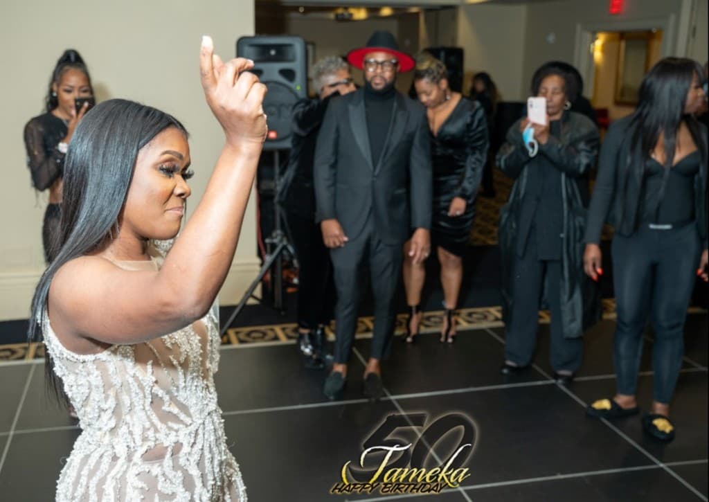 Celebration on the dance floor at a 50th birthday event photographed by Forte Media